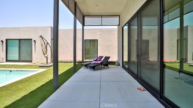 sunroom / solarium with a swimming pool