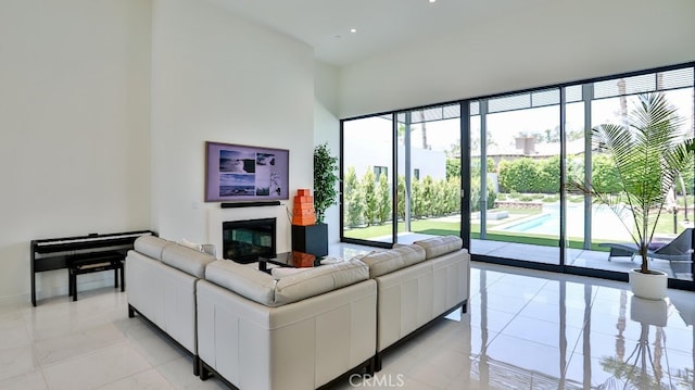 tiled living room with expansive windows