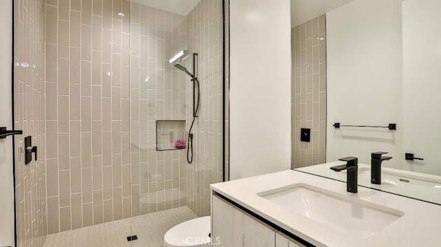 bathroom featuring vanity, toilet, and walk in shower