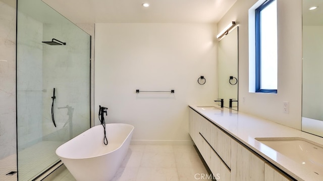 bathroom with tile patterned floors, vanity, a healthy amount of sunlight, and shower with separate bathtub