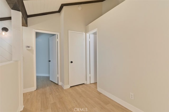 interior space with lofted ceiling, light wood-type flooring, and wooden ceiling