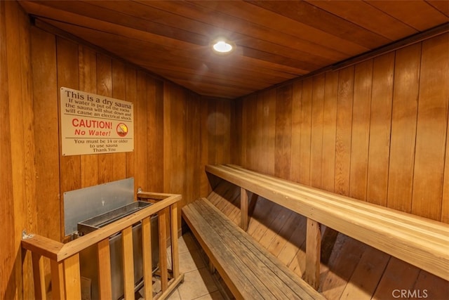 view of sauna / steam room featuring wood walls, wooden ceiling, and hardwood / wood-style floors