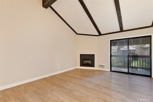 unfurnished living room featuring high vaulted ceiling, beamed ceiling, and hardwood / wood-style floors