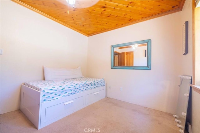 unfurnished bedroom with light colored carpet, ornamental molding, and wood ceiling