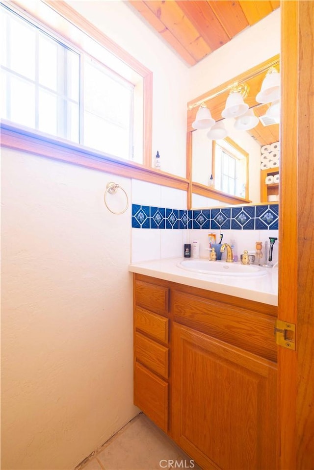 bathroom with vanity and wood ceiling