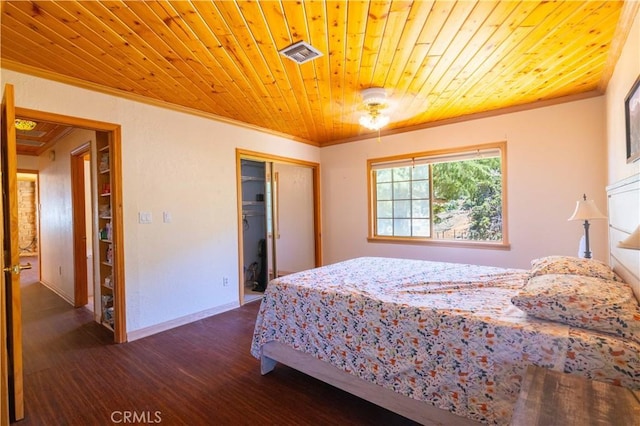 bedroom with dark hardwood / wood-style flooring, wooden ceiling, crown molding, and a closet