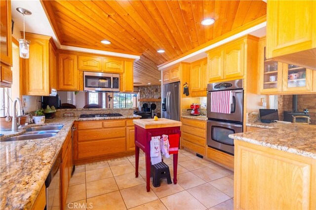 kitchen featuring sink, hanging light fixtures, stainless steel appliances, light tile patterned floors, and wood ceiling