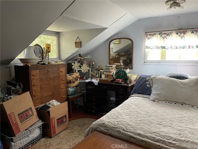 bedroom featuring lofted ceiling