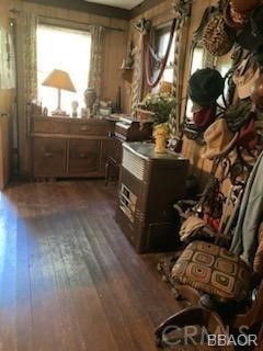 miscellaneous room featuring dark wood-type flooring