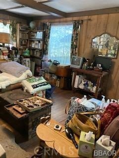 miscellaneous room with hardwood / wood-style floors and wood walls