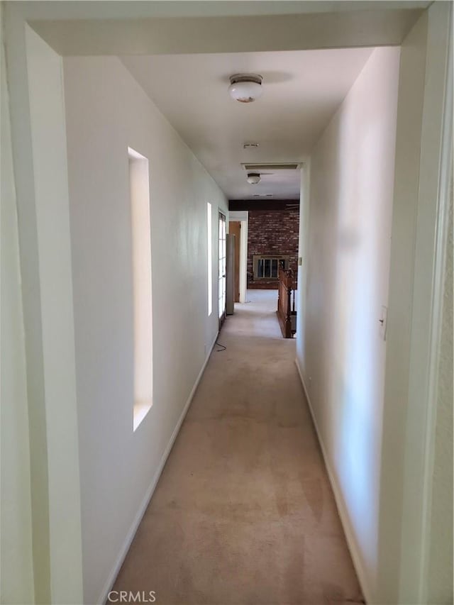 corridor with light colored carpet