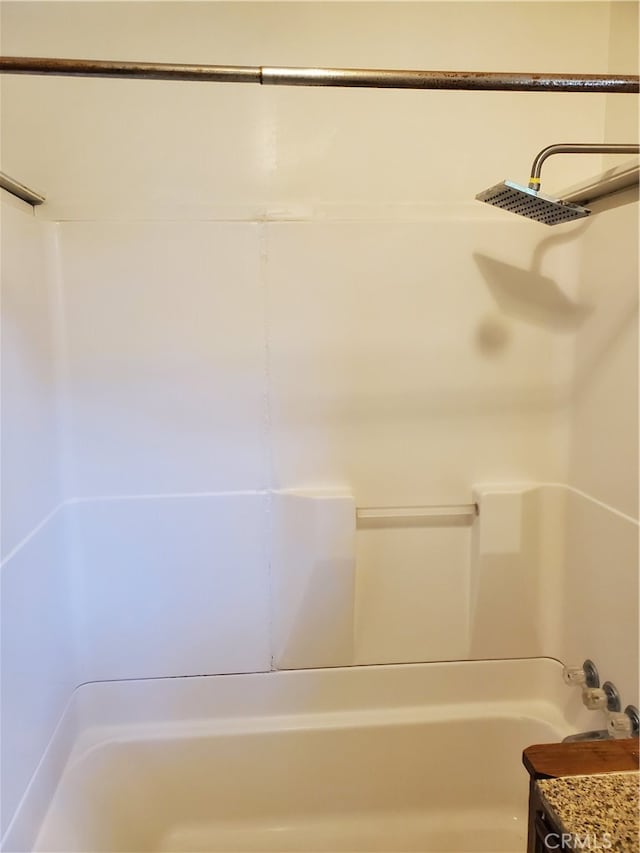 bathroom with shower / tub combination