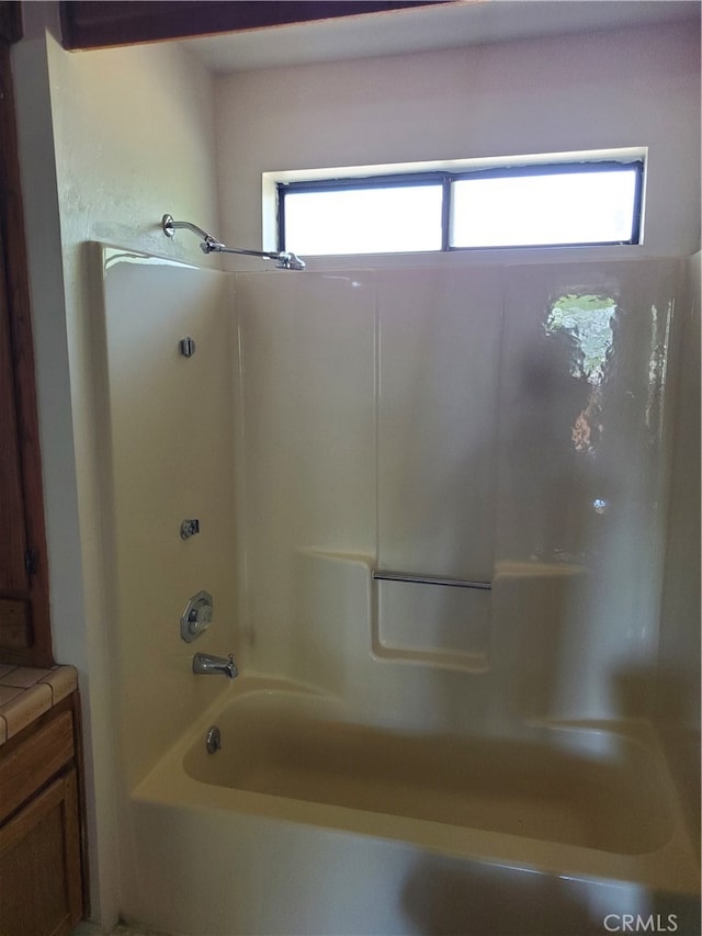 bathroom with vanity and tub / shower combination