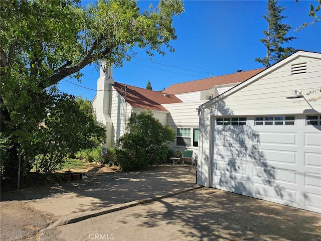 view of property exterior with a garage