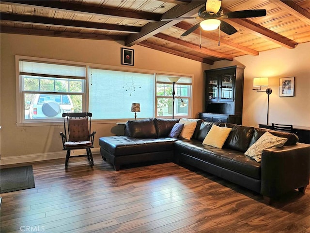 living room with a wealth of natural light, dark hardwood / wood-style flooring, and lofted ceiling with beams