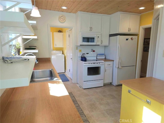 kitchen featuring white appliances, pendant lighting, wooden ceiling, white cabinets, and washer / clothes dryer