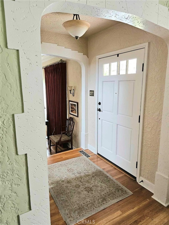 entryway featuring dark wood-type flooring