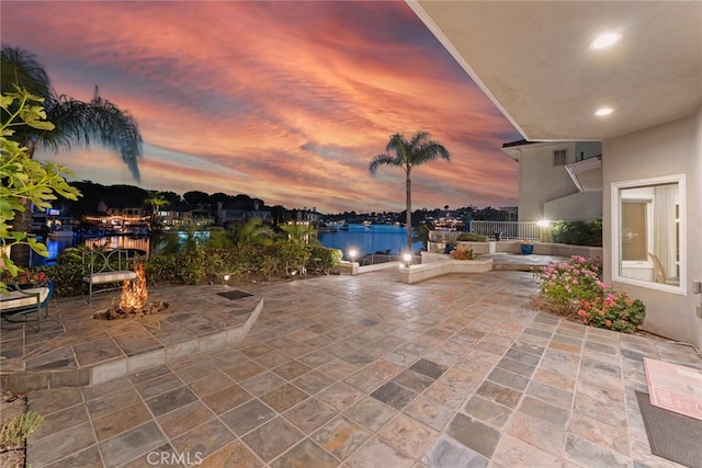 patio terrace at dusk with a water view