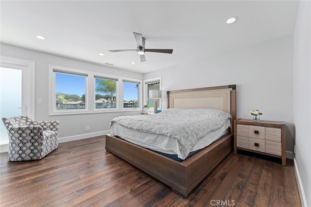 bedroom featuring ceiling fan and dark hardwood / wood-style flooring