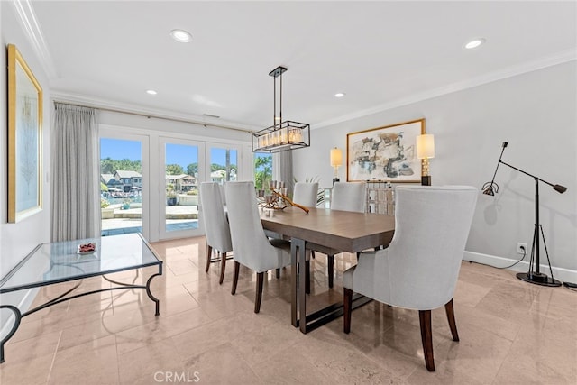 tiled dining room featuring ornamental molding and french doors