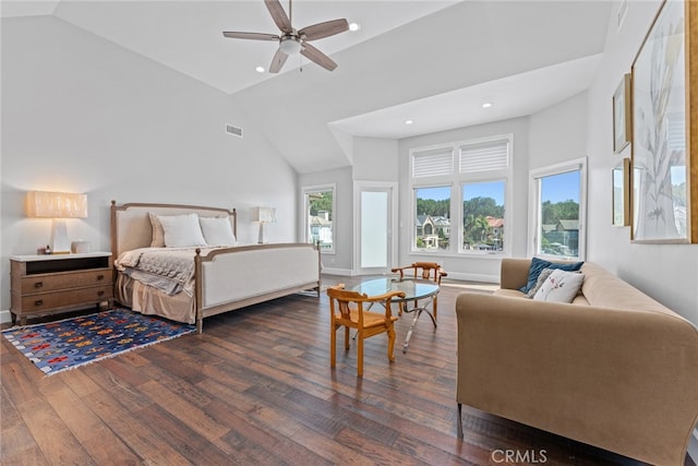 bedroom with dark wood-type flooring, ceiling fan, and high vaulted ceiling