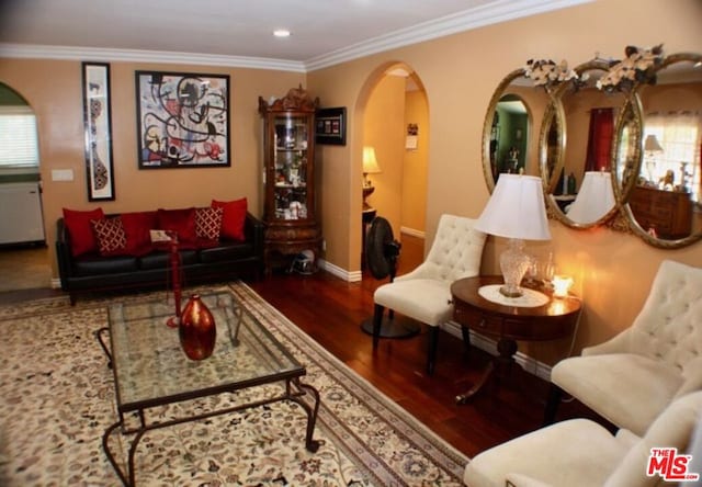 living room featuring crown molding and wood-type flooring