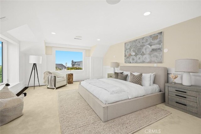 bedroom featuring light colored carpet