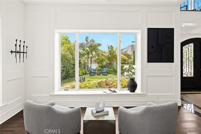 dining space featuring plenty of natural light and dark hardwood / wood-style flooring