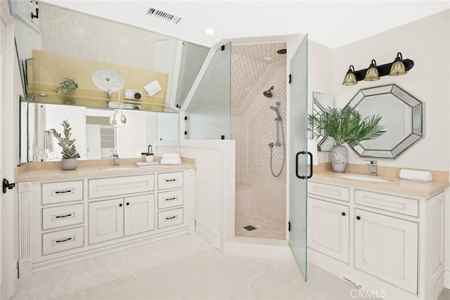 bathroom featuring tile patterned floors, vanity, and walk in shower