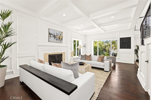 living room featuring beam ceiling, dark wood-type flooring, and coffered ceiling