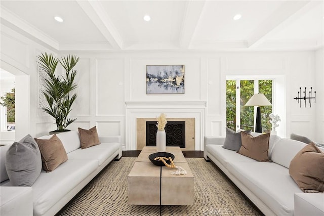 living room with beamed ceiling and crown molding