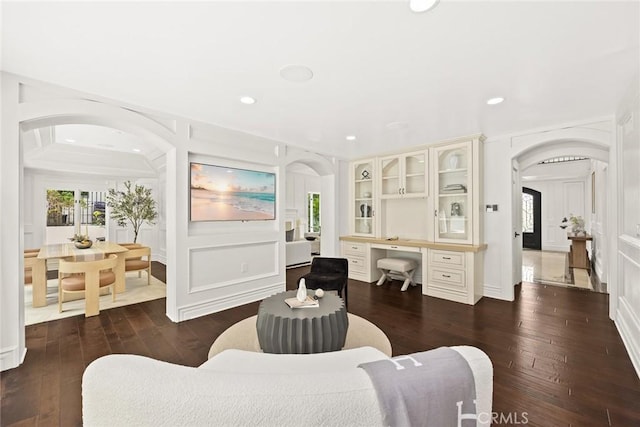 living room with dark hardwood / wood-style floors