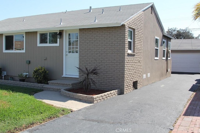 view of front of house featuring an outbuilding and a garage