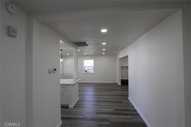 hall with dark wood-type flooring