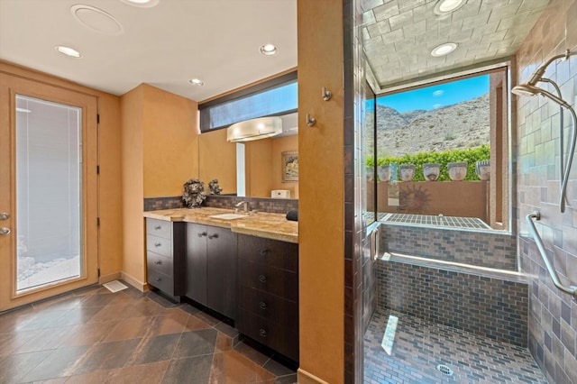 interior space featuring a mountain view, dark brown cabinets, and sink