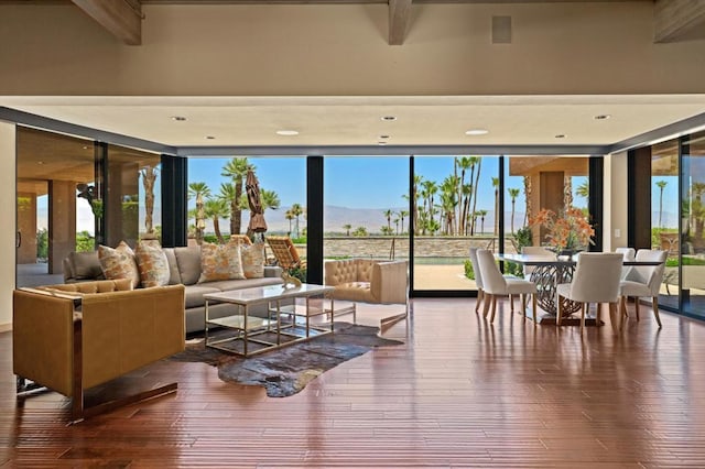 sunroom / solarium with a mountain view and a wealth of natural light