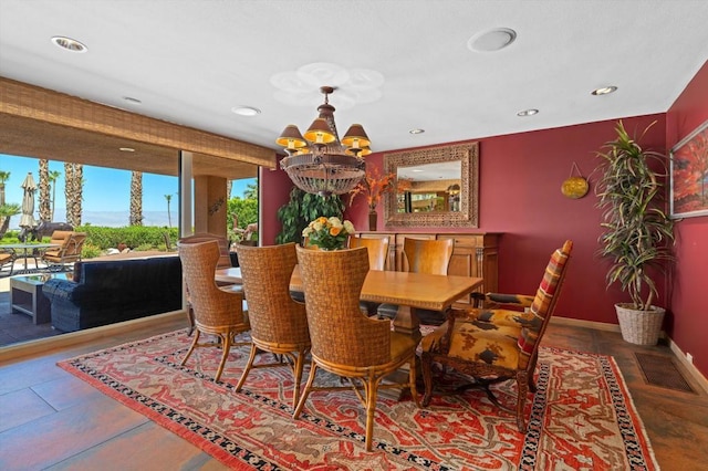 dining area featuring an inviting chandelier