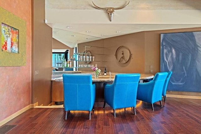 dining area featuring dark hardwood / wood-style floors