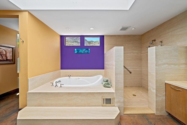 bathroom featuring vanity and separate shower and tub