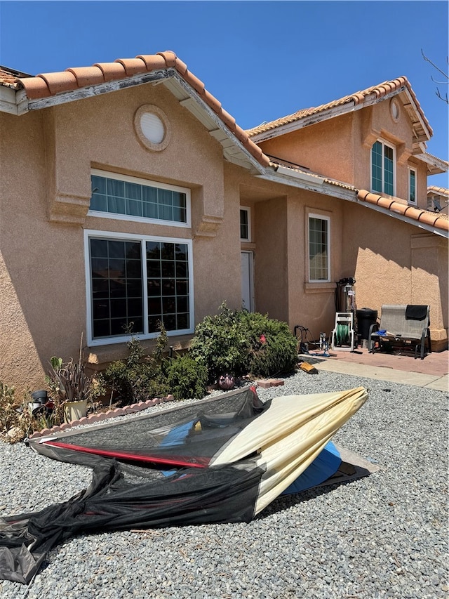 rear view of house featuring a patio area