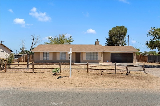 single story home featuring a garage