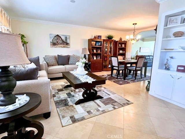 tiled living room with built in shelves, crown molding, and a chandelier