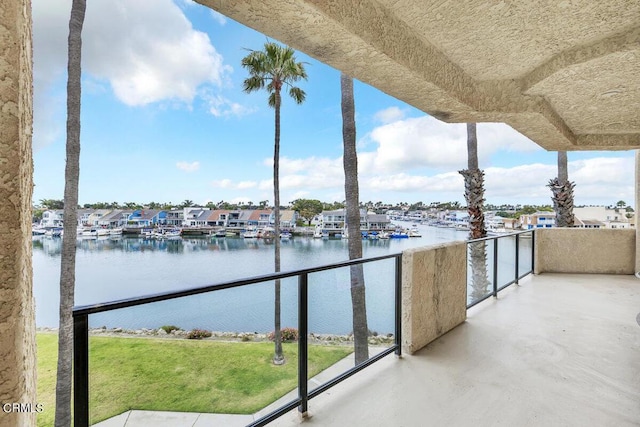 balcony featuring a water view