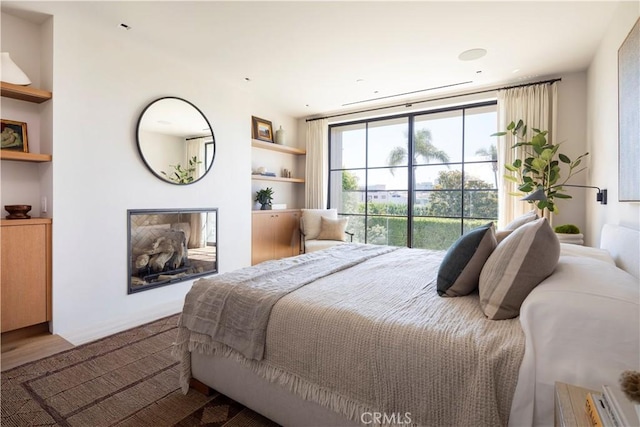 bedroom with hardwood / wood-style flooring