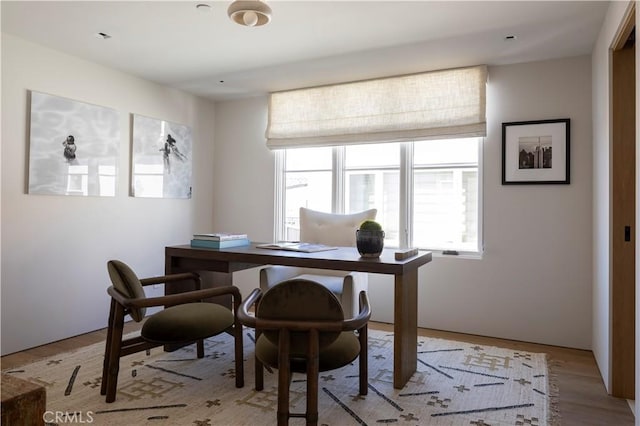 office space with light hardwood / wood-style flooring