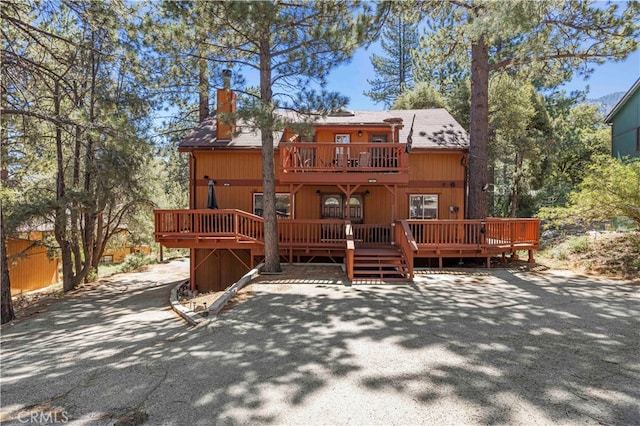 view of front of house featuring a wooden deck