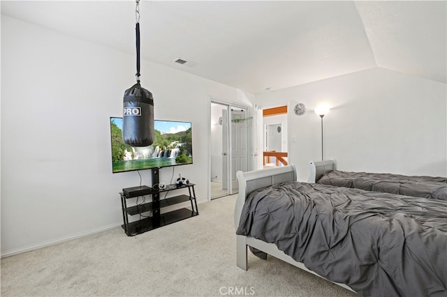 bedroom with carpet flooring and lofted ceiling