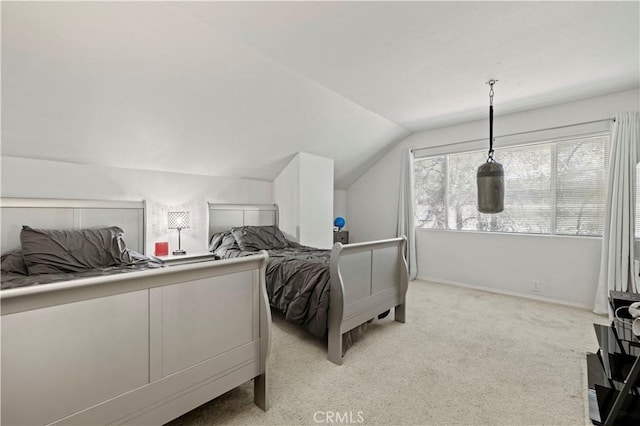 bedroom featuring baseboards, vaulted ceiling, and light carpet