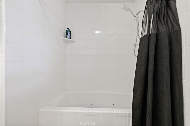 bathroom with shower / bathtub combination with curtain