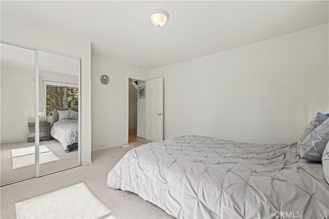 bedroom with a closet and carpet
